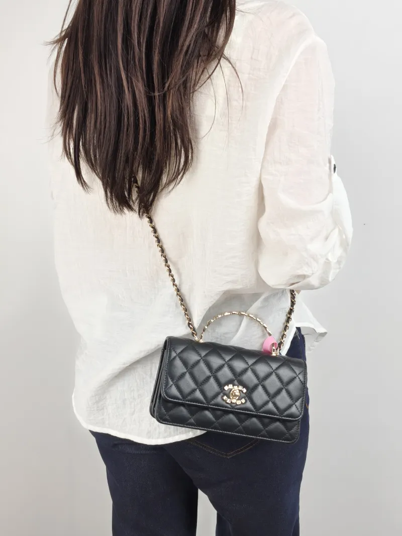 Chanel Crossbody Bag woc Black Lambskin One Size 19 × 6.5 × 10.5 cm — on-model view 2 of 2