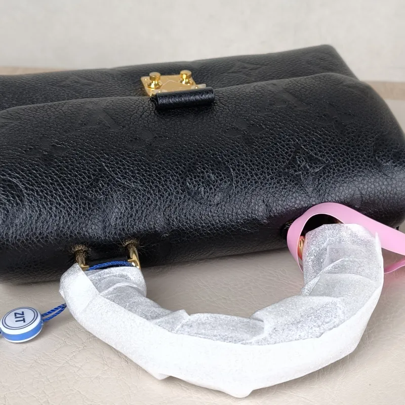 Louis Vuitton Crossbody Bag MADELEINE Black Monogram Empreinte Embossed Calfskin nano 21 × 6 × 12.5 cm — detail view 2 of 11