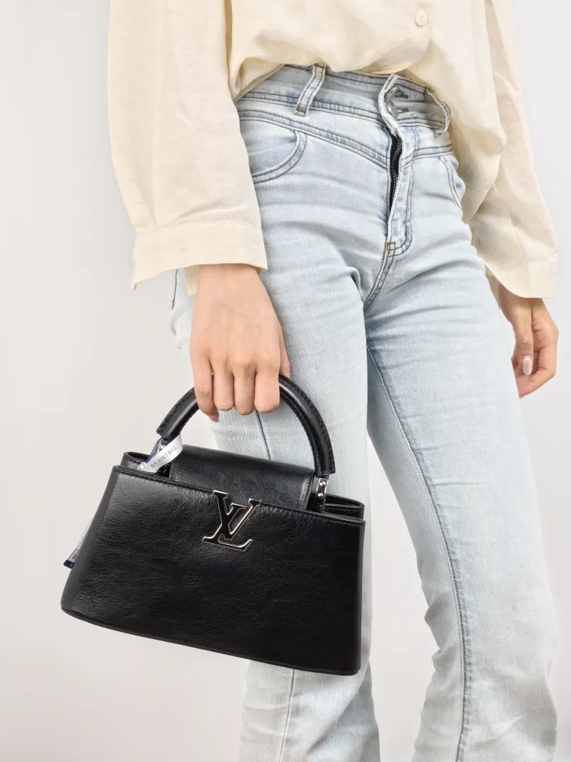 Louis Vuitton Crossbody Bag Capucines East West Black Calfskin BB 26.5 × 8 × 14 cm — on-model view 3 of 3