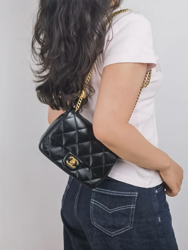 Chanel Crossbody Bag 23p Black Lambskin Mini 20 × 8 × 14 cm — on-model view 2 of 2