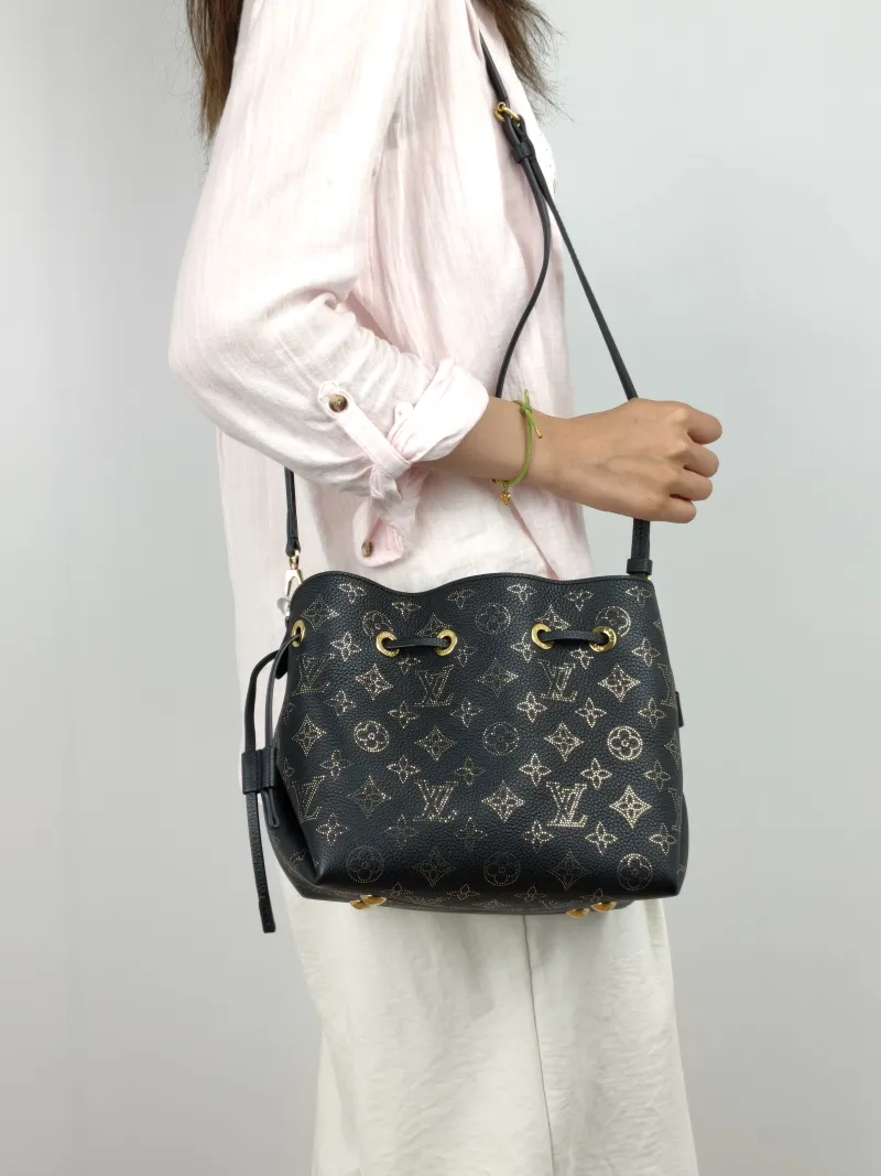 Louis Vuitton Crossbody Bag BELLA Black Calfskin One Size22 × 14 × 19 cm — on-model view 1 of 3