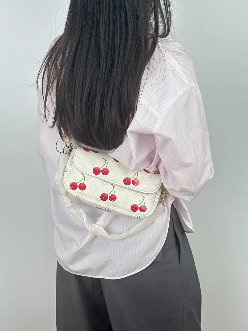 Louis Vuitton Crossbody Bag IVY White · PVC Small 23.5 × 4.3 × 12 cm Conditioned — on-model view 2 of 2
