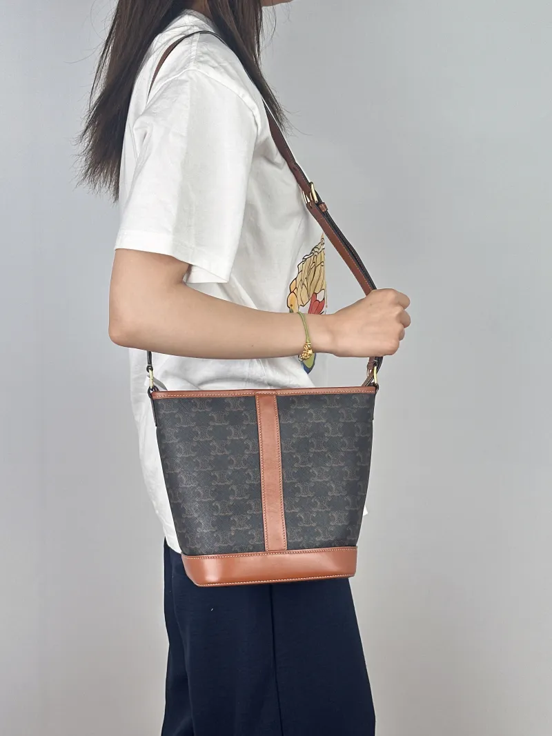 CELINE Crossbody Bag Triomphe Bucket Bag Monogram PVC Small22 × 13 × 26 cm — on-model view 2 of 2