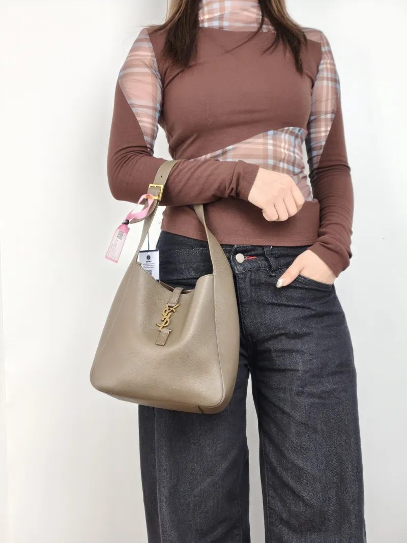 SAINT LAURENT Shoulder Bag LE 5 À 7 Hobo Calfskin Small 22 × 8.5 × 23 cm — on-model view 1 of 2