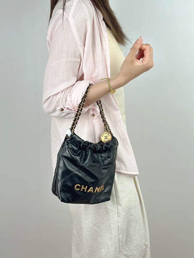 Chanel Shoulder Bag22Bag Black CC alfskinmini20 × 6 × 19 cm — on-model view 1 of 2