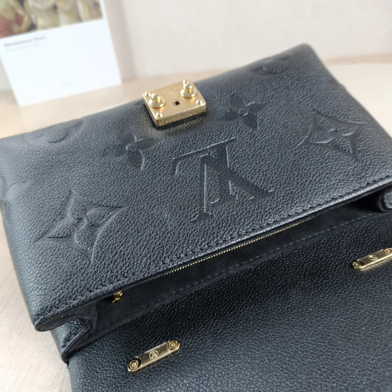 Louis Vuitton Crossbody Bag MADELEINE Black Empreinte Embossed Calfskin BB 24 × 8.5 × 17 cm — detail view 11 of 15