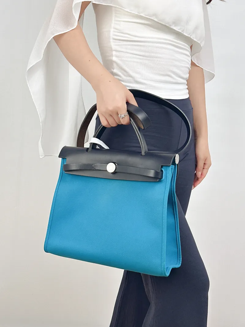 Hermès Crossbody Bag Herbag 31B3 Canvas Medium30.5 × 11 × 25.5 cm — on-model view 1 of 2
