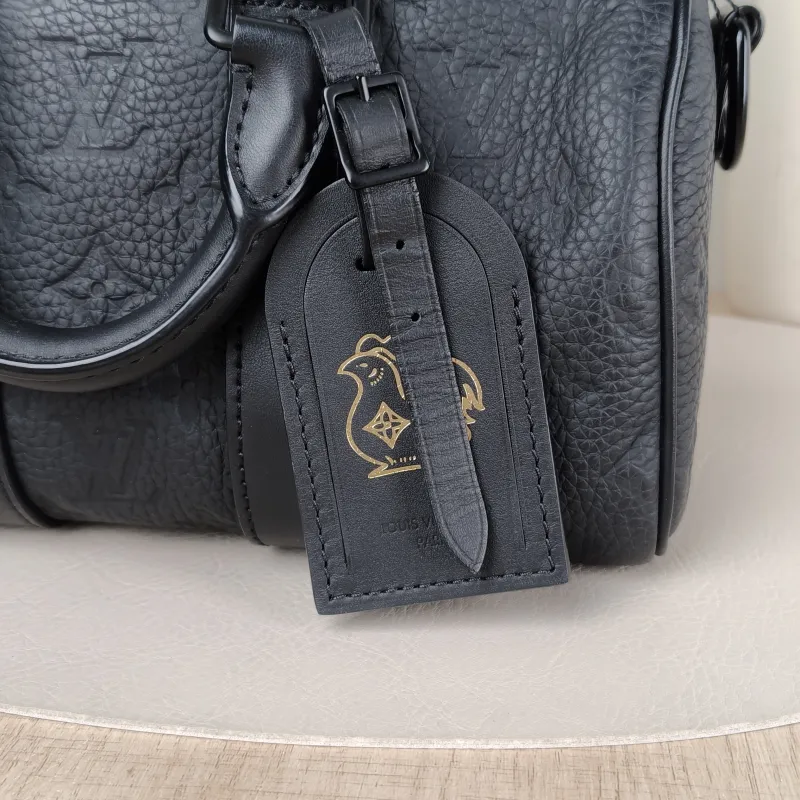 Louis Vuitton Crossbody Bag Keepall 25 Taurillon Monogram Embossed Calfskin Medium 25 × 11 × 15 cm — detail view 2 of 11