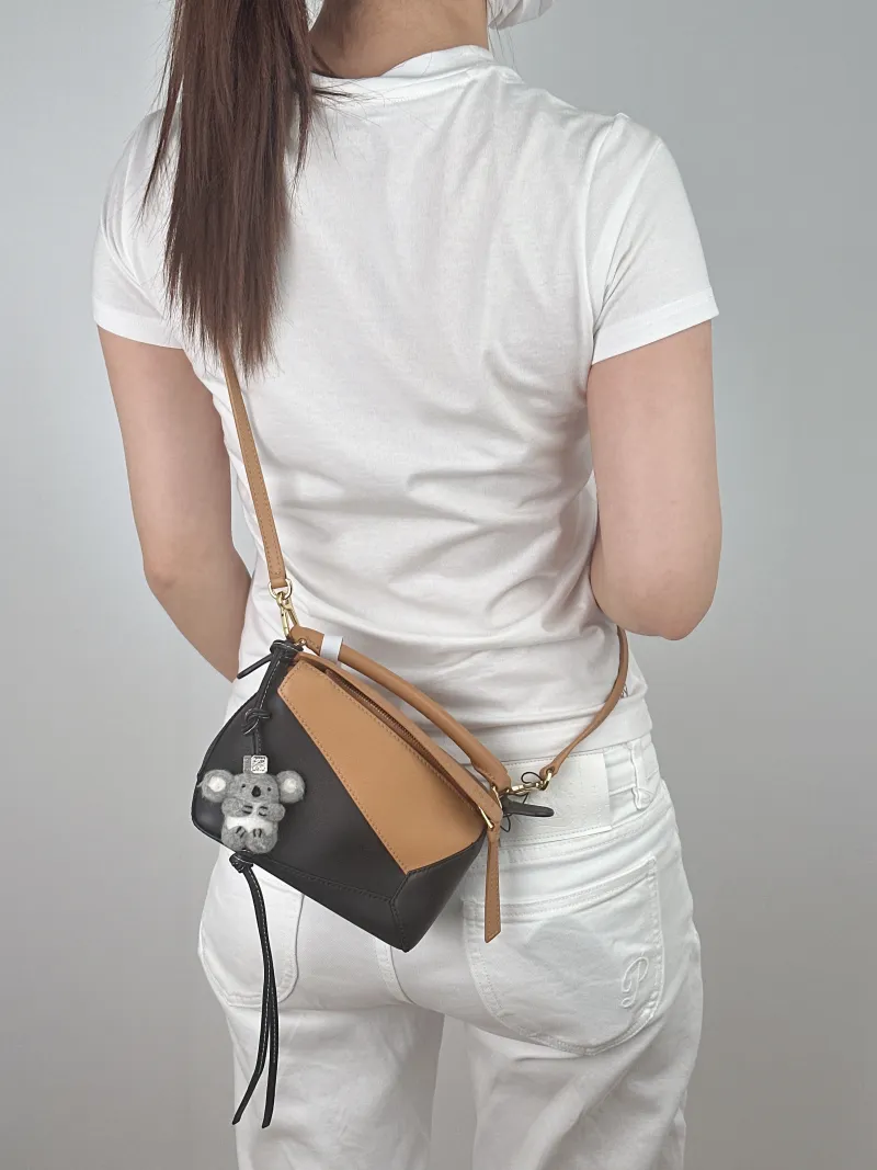 LOEWE Crossbody Bag Puzzle Black Brown Calfskin Mini 18 × 8 × 12.5 cm — on-model view 1 of 2