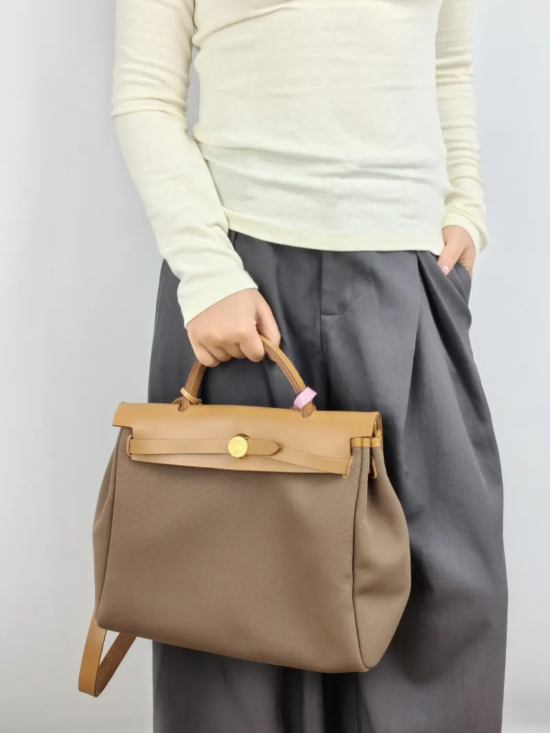 Hermès Crossbody Bag Herbag 31 Calfskin，Canvas Medium 30.5 × 11 × 25.5 cm B — on-model view 1 of 2