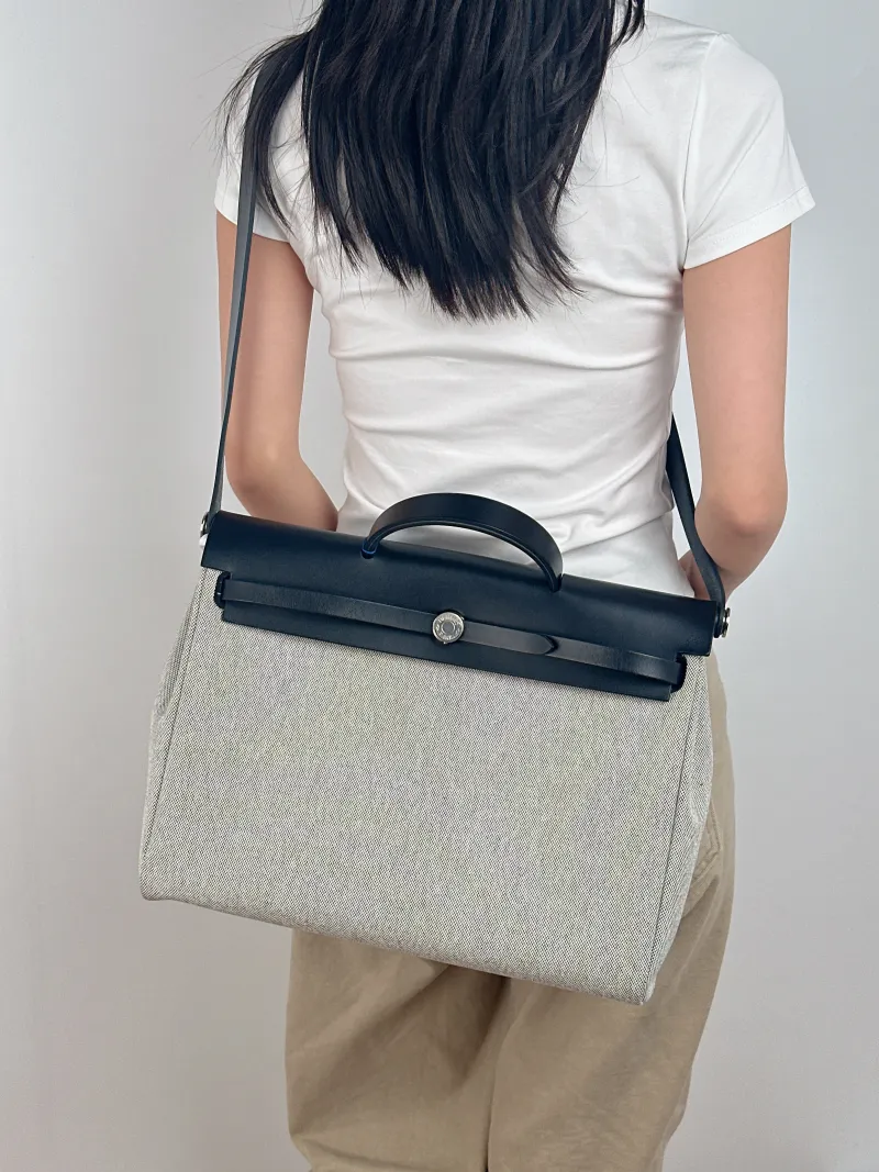 Hermès Top Handle Bag herbag messenger 39 Top Handle Bag Beige Black Canvas · Calfskin One Size 36 × 9 × 28 cm k — on-model view 1 of 3
