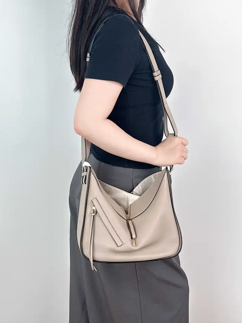 LOEWE Crossbody Bag Hammock Brown Calfskin Medium 29 × 14 × 32 cm — on-model view 1 of 2