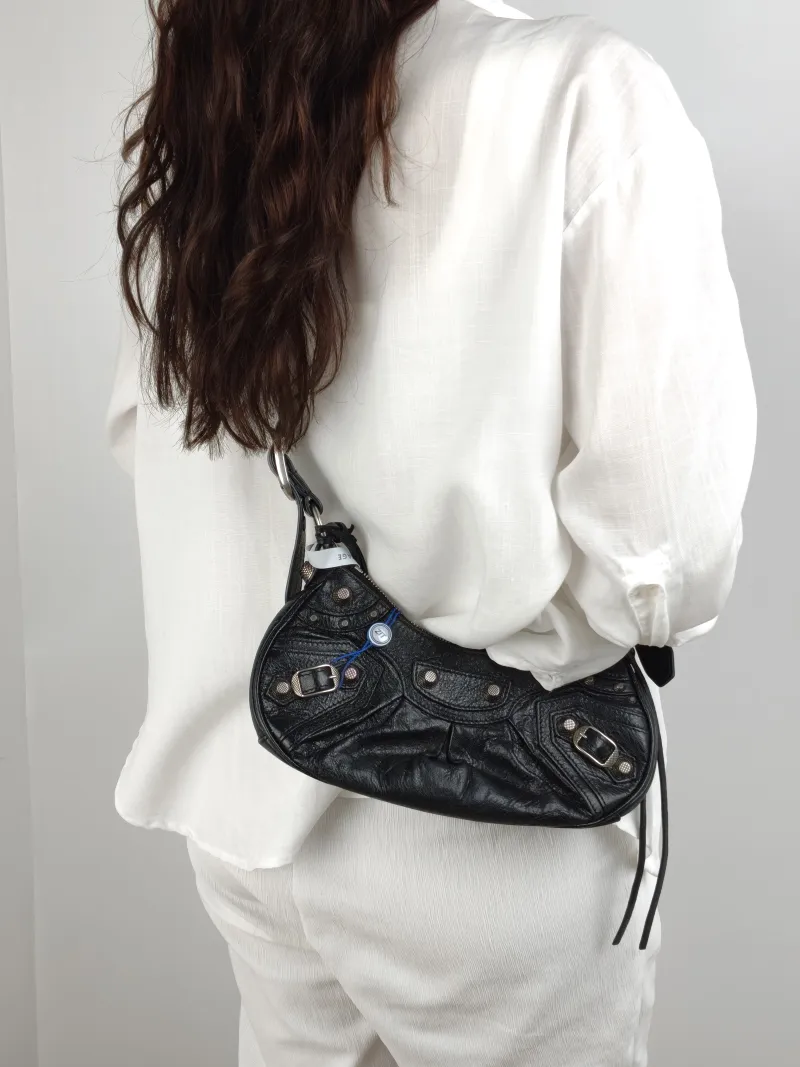 BALENCIAGA Crossbody Bag LE CAGOLE Black Lambskin XS 26 × 7 × 16 cm — on-model view 1 of 2