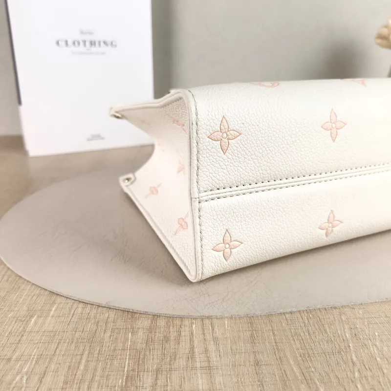 Louis Vuitton Shoulder Bag Onthego Beige · Pink Monogram Empreinte Embossed Calfskin Small 25 × 11.5 × 19 cm — detail view 1 of 12