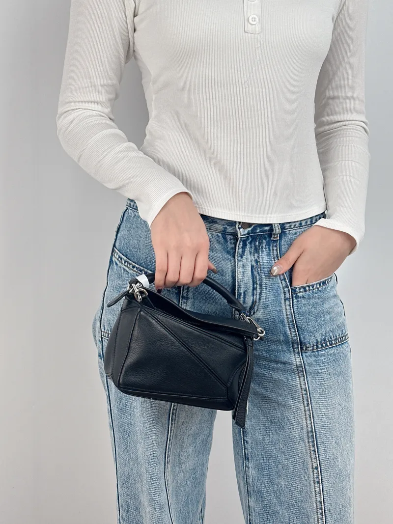 LOEWE Crossbody Bag Puzzle Black CC alfskin Mini 18 × 8 × 12.5 cm — on-model view 2 of 2