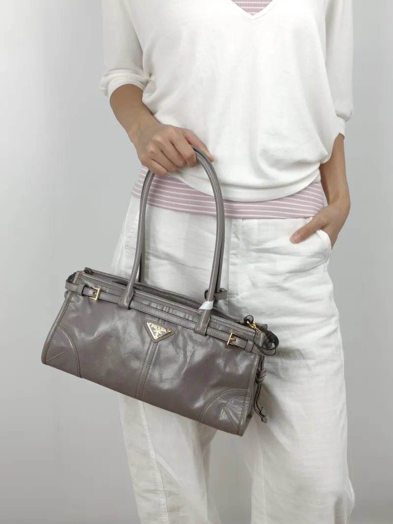 PRADA Shoulder Bag Bonnie Soft Lux Grey Waxed Leather Calfskin Medium 32 × 12 × 15.5 cm — on-model view 3 of 3