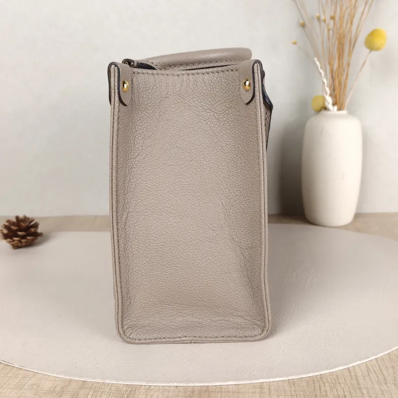 Louis Vuitton Shoulder Bag Onthego · White Monogram Empreinte Embossed Calfskin Small25 × 11.5 × 19 cm — detail view 11 of 11