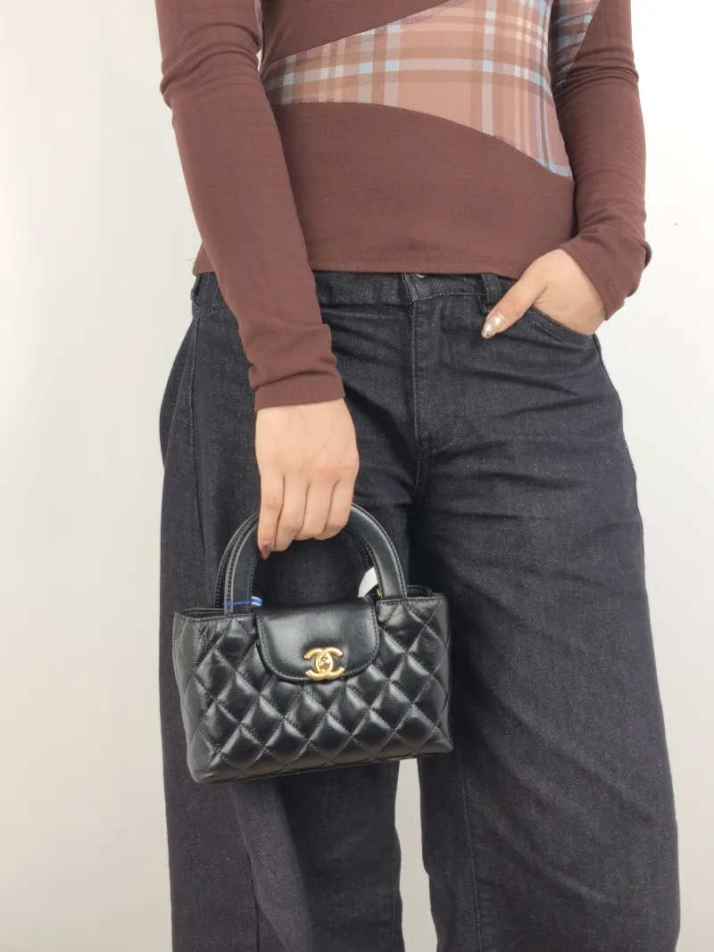 Chanel Shoulder Bag Kelly Black Waxed Leather Small 19 × 7 × 13 cm — on-model view 2 of 3