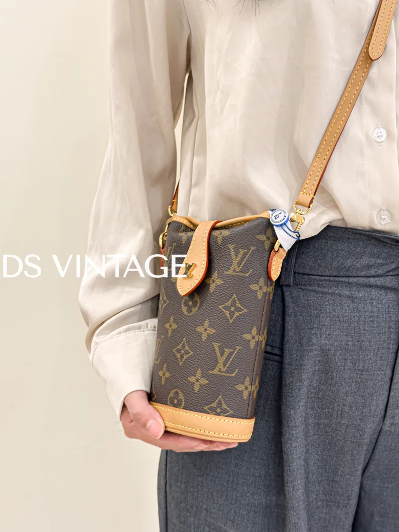 Louis Vuitton Crossbody Bag Fold Me Monogram PV Cmini14.5 × 6.5 × 18 cm — on-model view 1 of 3