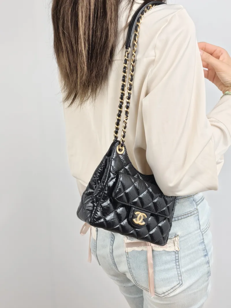 Chanel Crossbody Bag HOBO Black Waxed Leather Calfskin Small 19 × 6 × 17 cm — on-model view 1 of 2