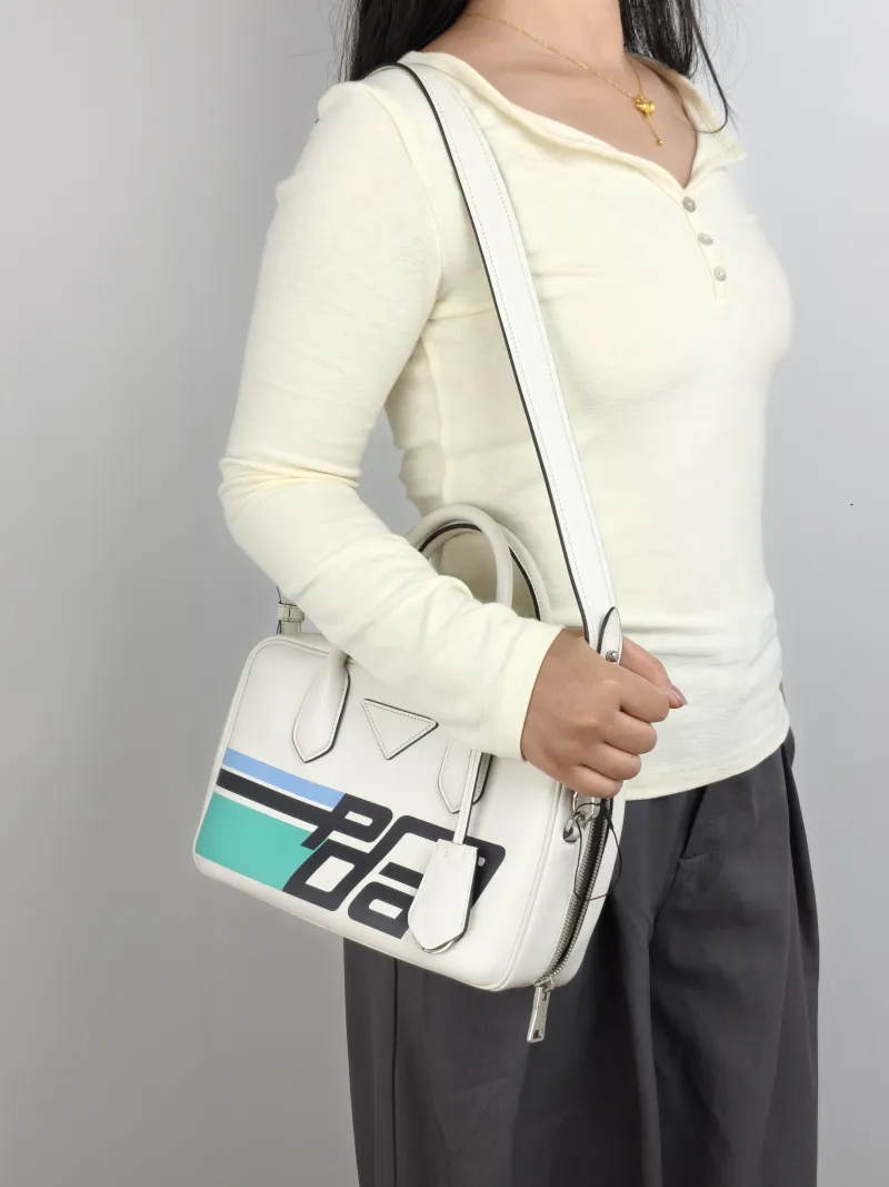 PRADA Top Handle Bag Tote Bag White Calfskin 26 × 18.5 × 16.5 cm — on-model view 1 of 2