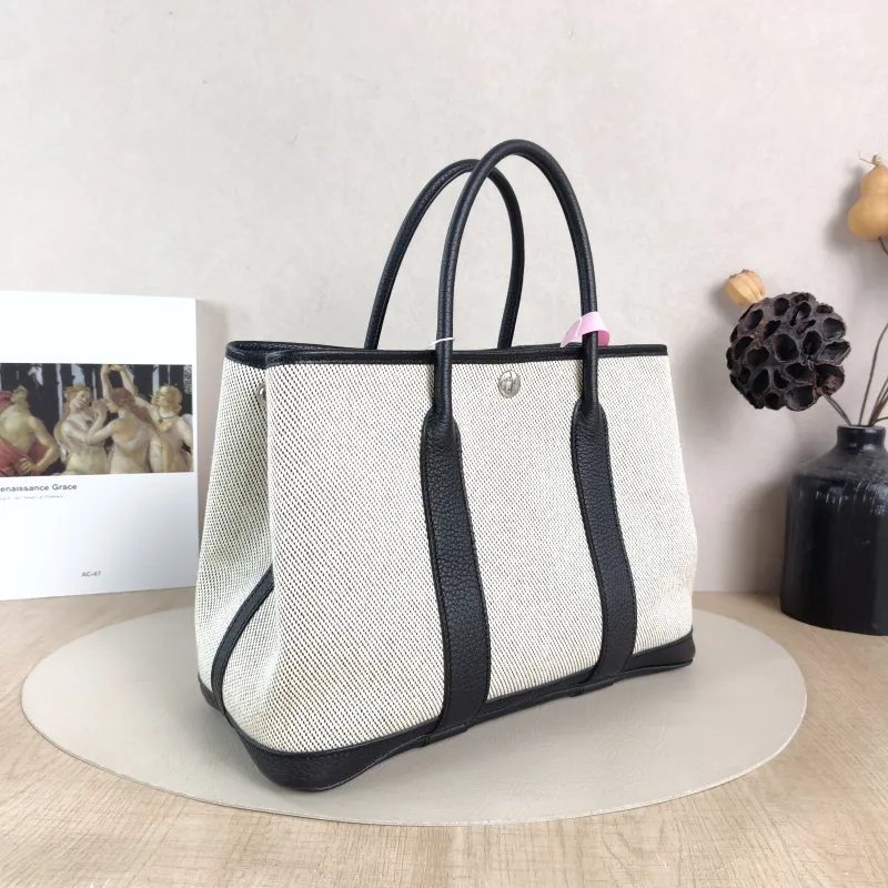 Hermès Top Handle Bag Garden Party 30 30 Beige · Black Canvas · Negonda Calfskin Medium 30 × 13 × 21 cm B — cover view 2 of 6