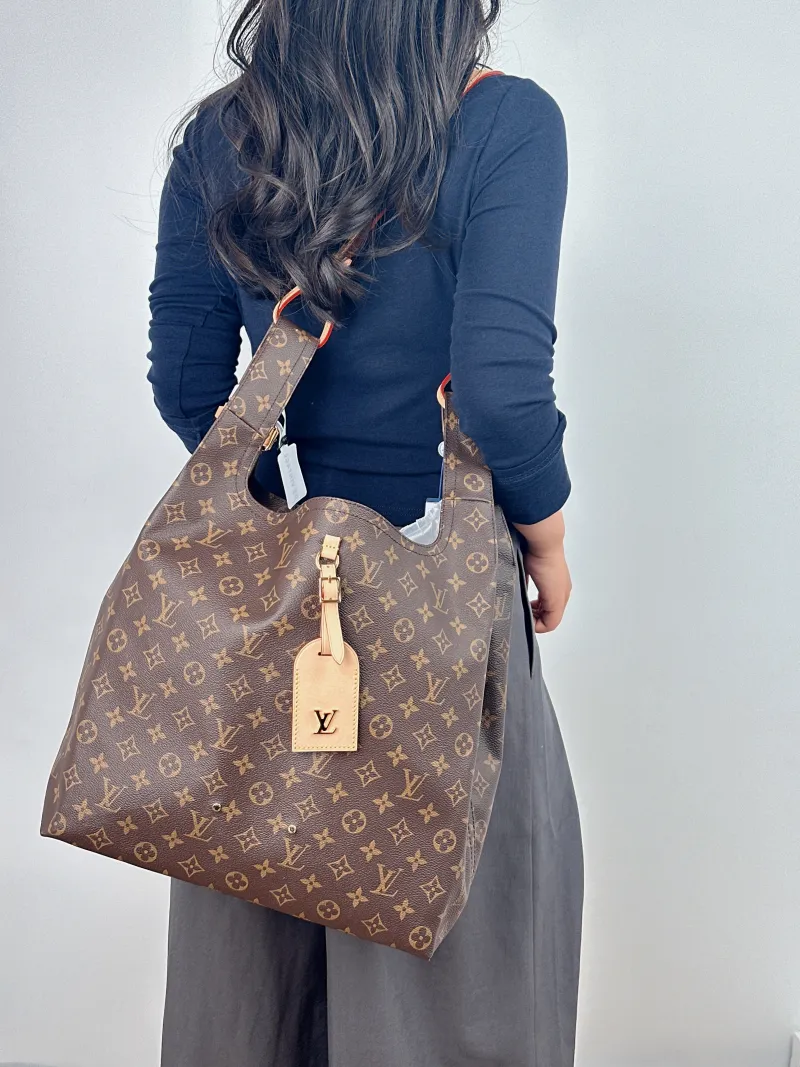 Louis Vuitton Top Handle Bag ATLANTIS Monogram PVC Large 34 × 13.5 × 34 cm — on-model view 1 of 2