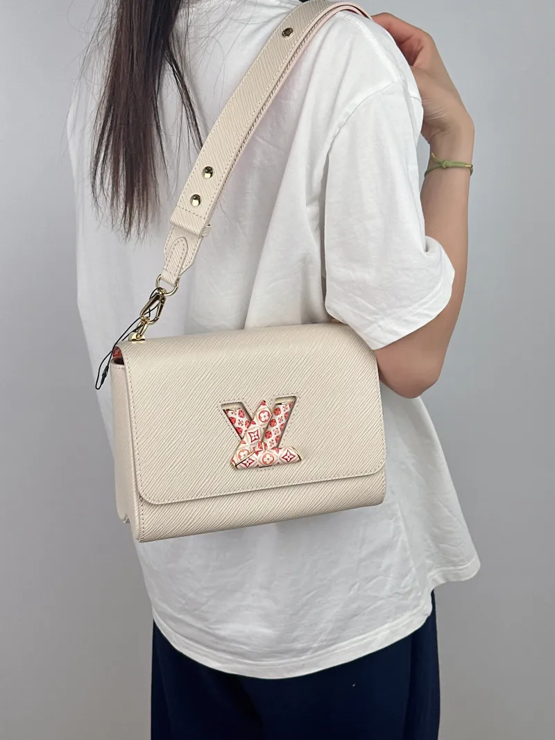 Louis Vuitton Crossbody Bag Twist White Epi Embossed Calfskin Pink 23 × 9.5 × 17 cm — on-model view 2 of 2