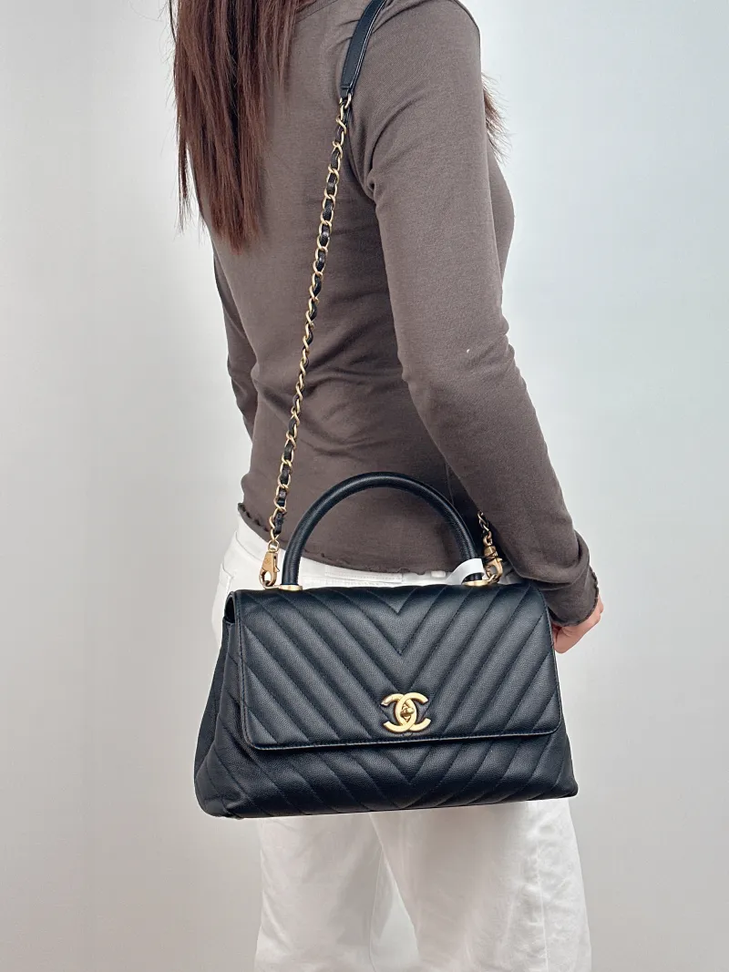 Chanel Top Handle Bag Coco Handle​ Black with Gold-Tone Hardware V Grained Calfskin Medium 29 × 12 × 18 cm 26 — on-model view 1 of 2