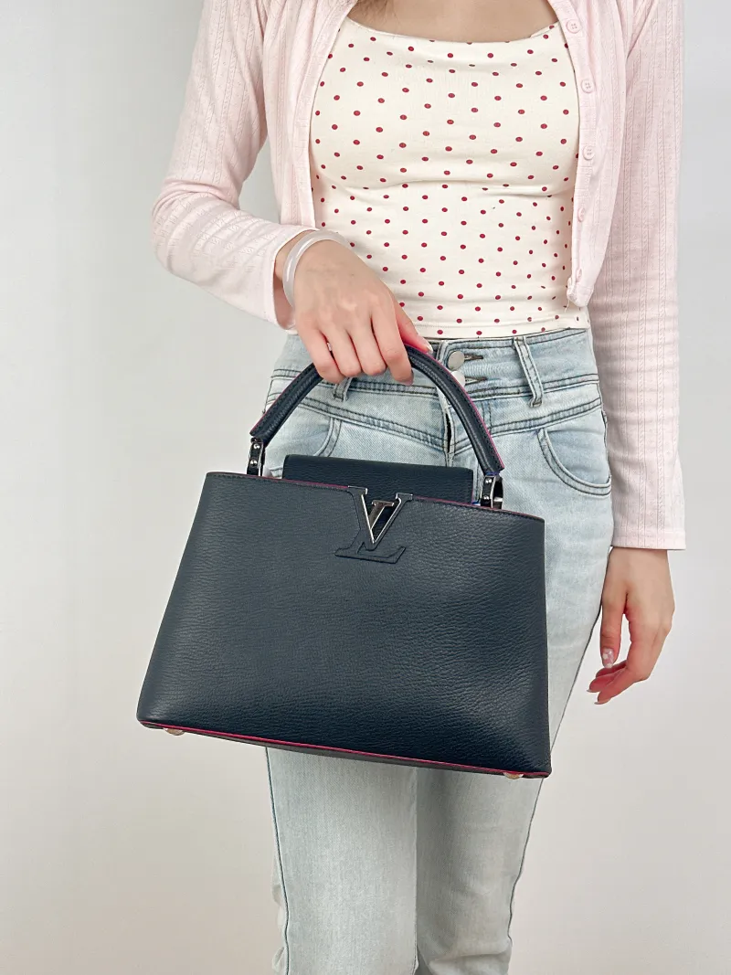 Louis Vuitton Top Handle Bag Capucines Black Calfskin Medium31.5 × 11 × 20 cm — on-model view 1 of 3