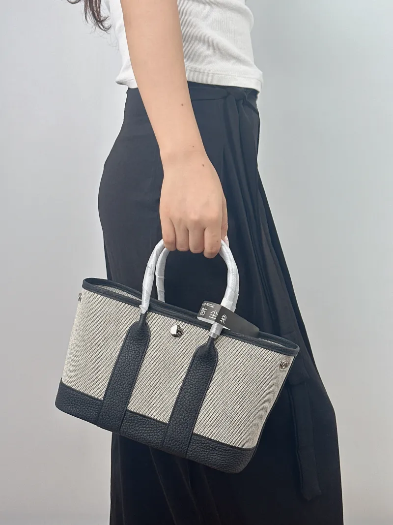 Hermès Top Handle Bag Neo Garden 23 Mini Black · Beige Canvas · Negonda Calfskin Mini 23 × 10 × 16 cm G — on-model view 2 of 2