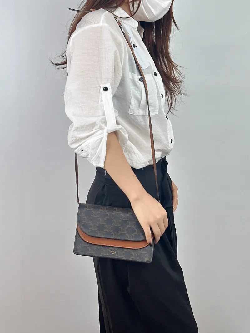 CELINE Crossbody Bag TRIOMPHE Clutchwoc Monogram PVC 20 × 6 × 12 cm — on-model view 1 of 2