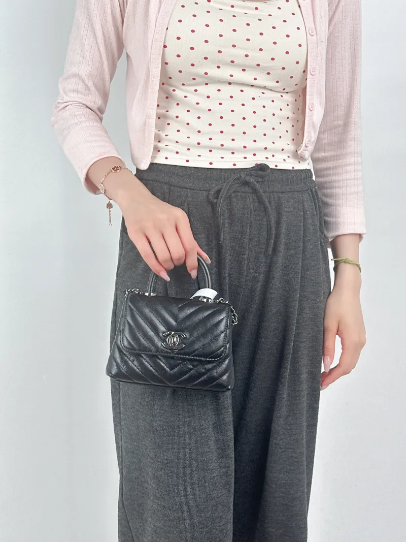 Chanel Crossbody Bag Coco Handle​Black V Calfskin Mini14.5 × 5.5 × 11.5 cm — on-model view 1 of 3