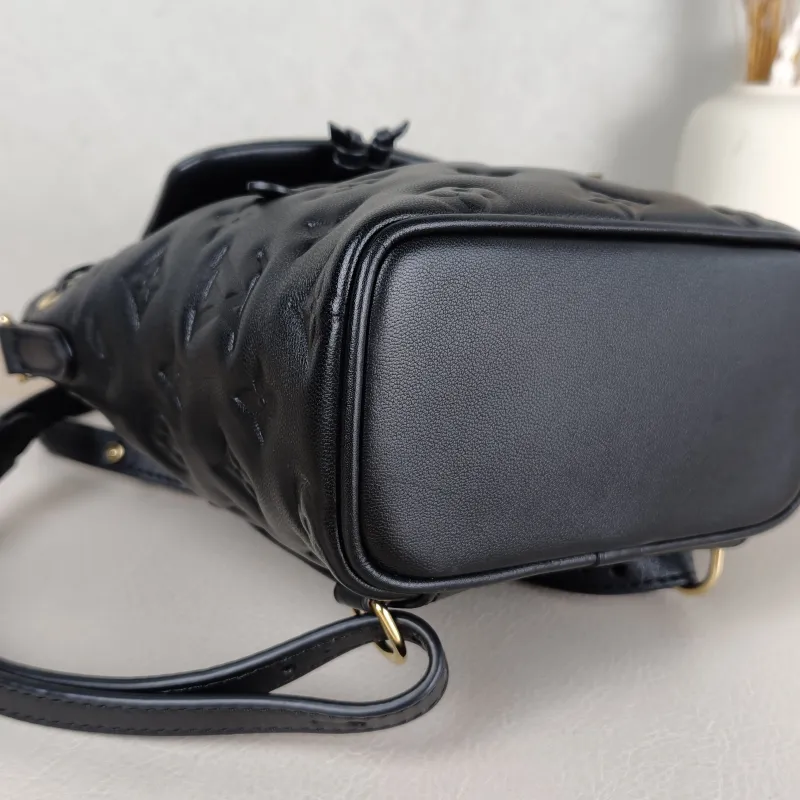 Louis Vuitton Backpack Coussin Backpack Black with Gold-Tone Hardware Lambskin Mini 15 × 7.5 × 20 cm — detail view 8 of 14