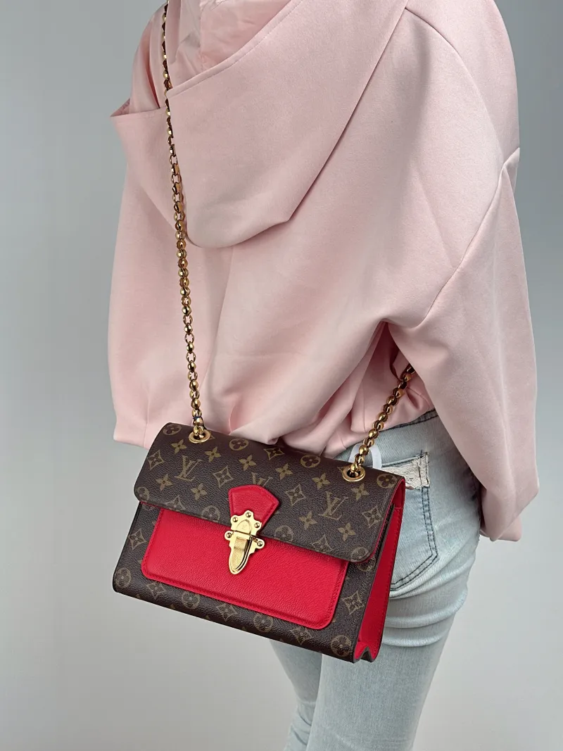 Louis Vuitton Crossbody Bag VICTOIRE Red PVC · Calfskin One Size 27 × 10 × 17 cm — on-model view 1 of 2