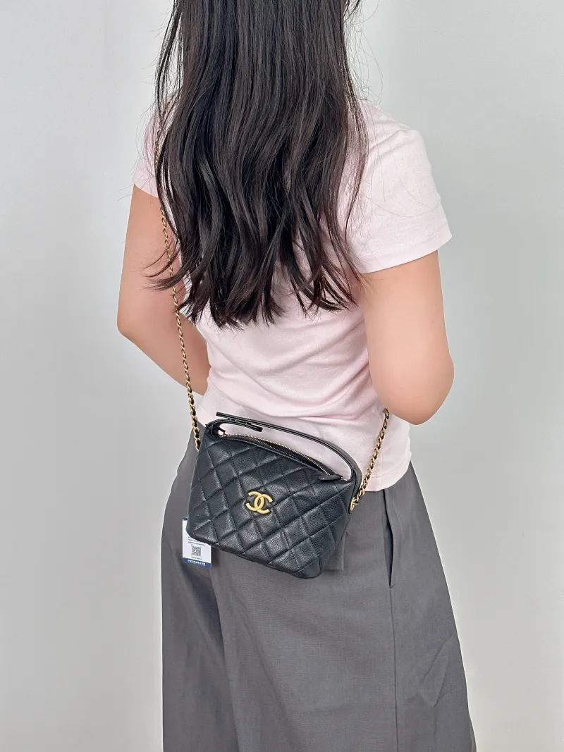 Chanel Crossbody Bag Gold-Tone Hardware Crossbody Bag Black Calfskin One Size21.5 × 7.5 × 19 cm — on-model view 1 of 2