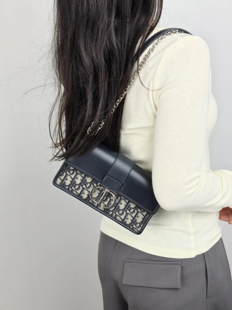 DIOR Crossbody Bag 30 Montaigne East-West 30 Blue Canvas， Small 21 × 6 × 12 cm — on-model view 1 of 3