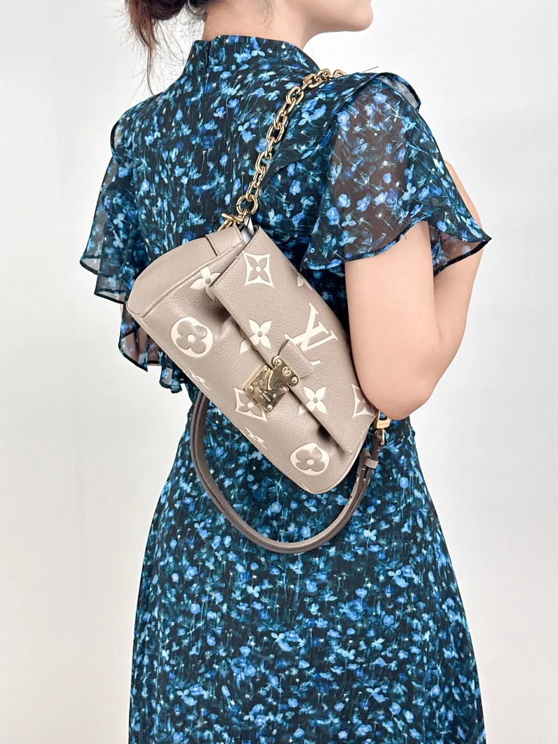 Louis Vuitton Crossbody Bag Favorite Empreinte Embossed Calfskin Monogram Medium24 × 9 × 14 cm — on-model view 2 of 3