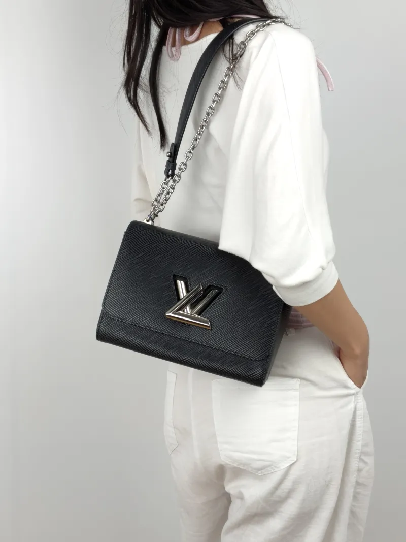 Louis Vuitton Crossbody Bag Twist Black Epi Embossed Calfskin Medium 23 × 9.5 × 17 cm — on-model view 2 of 3