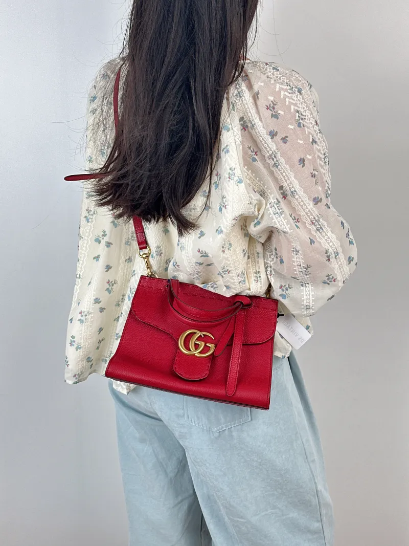 GUCCI Top Handle Bag Marmont Top Handle Bag Red Calfskin One Size26 × 11 × 18 cm — on-model view 1 of 3