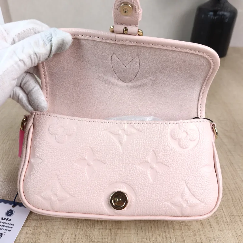 Louis Vuitton Crossbody Bag Diane Baguette Bag Monogram Empreinte Embossed Calfskin nano 19 × 6 × 10.5 cm — detail view 5 of 13