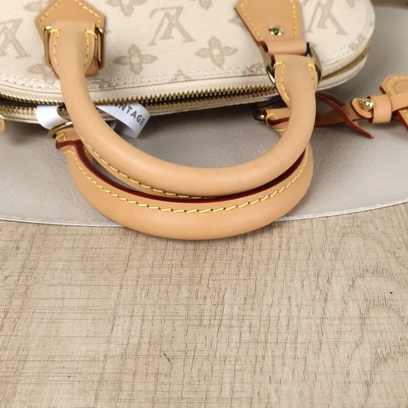 Louis Vuitton Top Handle Bag Alma BB PVCBB23.5 × 11.5 × 17.5 cm — detail view 1 of 12