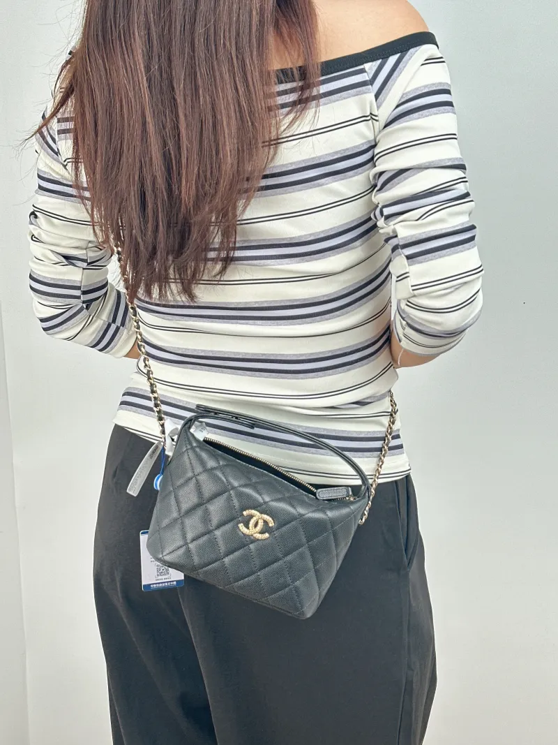 Chanel Crossbody Bag Gold-Tone Hardware Black Grained Calfskin 15.5 × 6 × 12.5 cm — on-model view 1 of 2