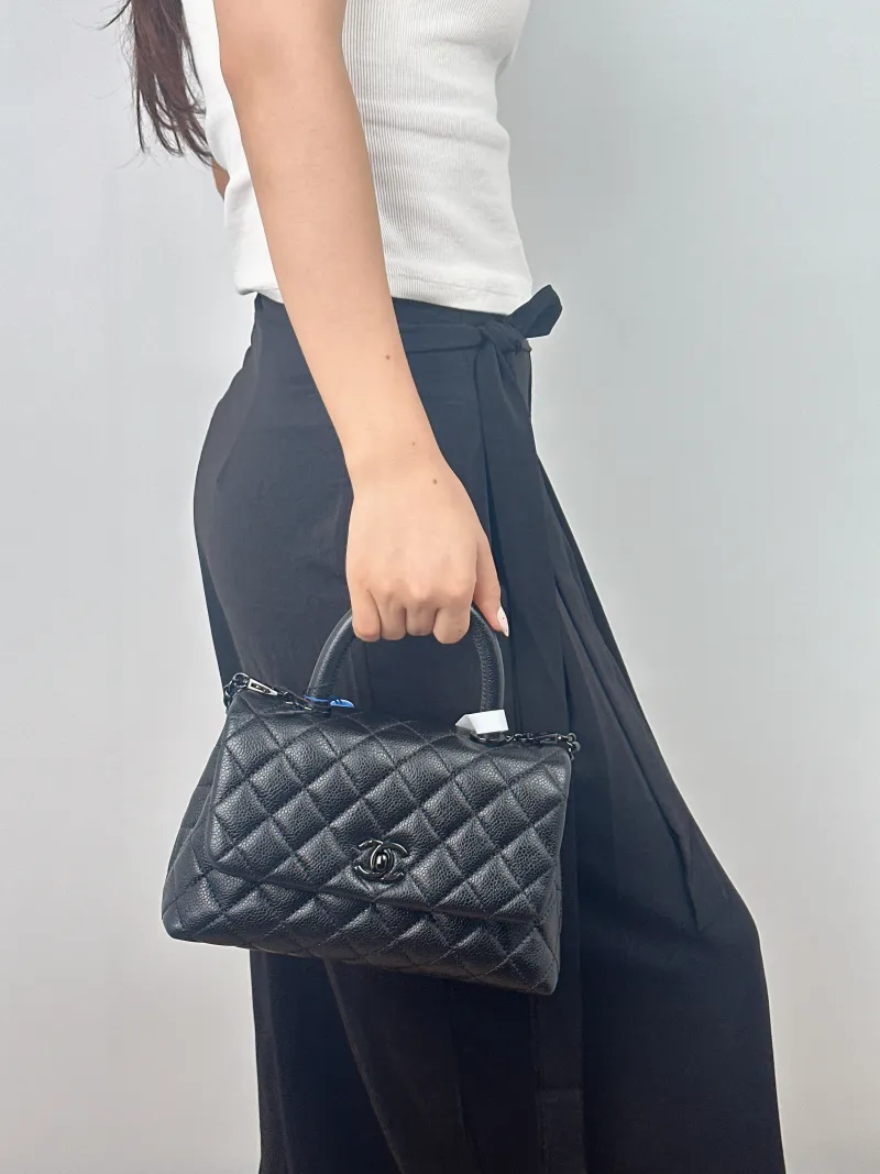 Chanel Crossbody Bag Coco Handle​Black Calfskin Small24 × 10 × 14 cm — on-model view 1 of 2