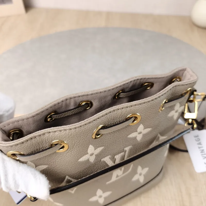 Louis Vuitton Crossbody Bag NANO NOÉ Bucket Bag Nano · White Monogram Empreinte Embossed Calfskin nano 13 × 10 × 16 cm — detail view 1 of 11