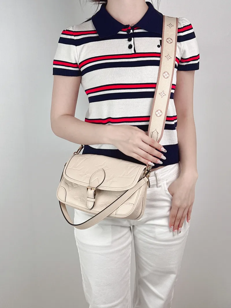 Louis Vuitton Crossbody Bag Diane Baguette Bag White Empreinte Embossed Calfskin Monogram Small24 × 9 × 15 cm — on-model view 1 of 2