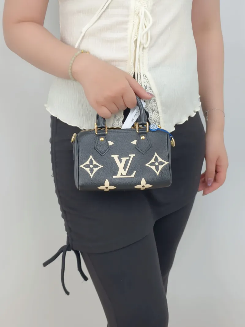 Louis Vuitton Crossbody Bag Speedy Nano Black · White Empreinte Embossed Calfskin Monogramnano16 × 7.5 × 10 cm — on-model view 3 of 3