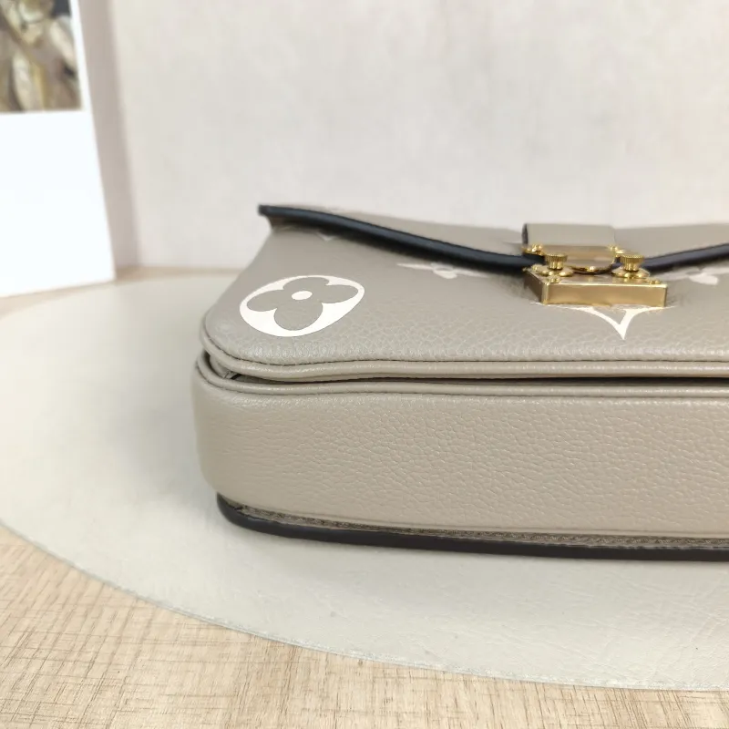 Louis Vuitton Crossbody Bag Pochette Métis East West Monogram Empreinte Embossed Calfskin Small 21.5 × 6 × 13.5 cm — detail view 11 of 13