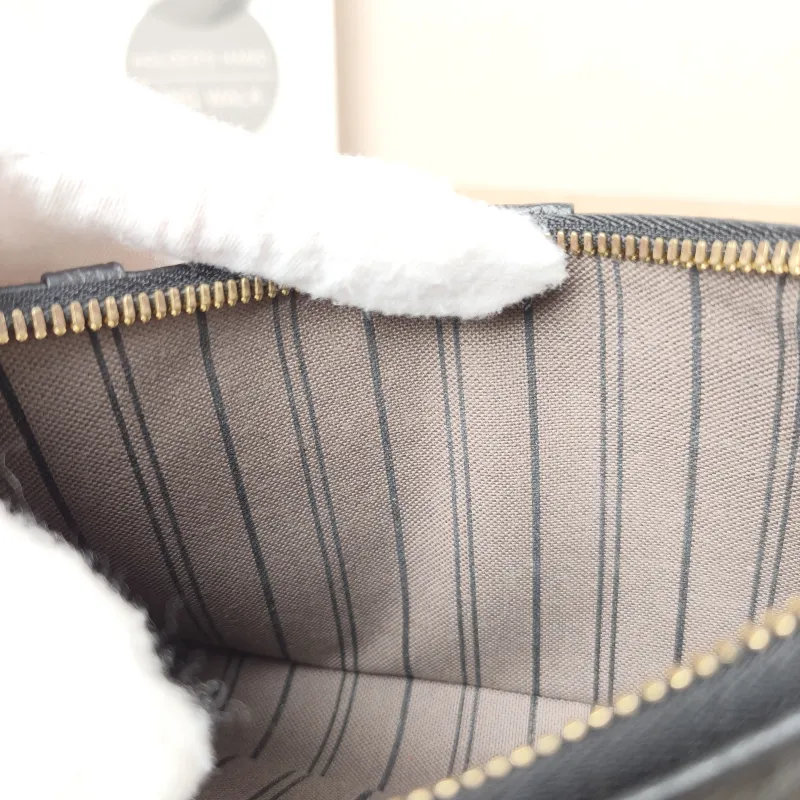 Louis Vuitton Crossbody Bag EASY POUCH ON STRAP Black Monogram Empreinte Embossed Calfskin Mini 19 × 3 × 11.5 cm — detail view 9 of 10