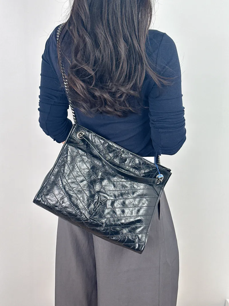SAINT LAURENT Shoulder Bag NIKI SHOPPING Shopping Tote Black Waxed Leather Medium33 × 11.5 × 27 cm — on-model view 1 of 2